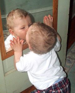 A 30-year journey to self-love - Baby kissing mirror