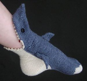 A sock that looks like a shark biting the foot