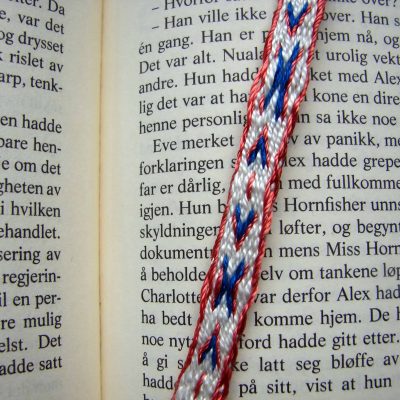 X and arrows tablet-woven bookmark close-up